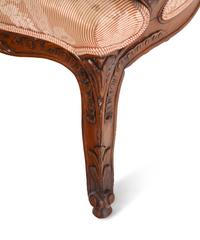 A Louis XV Style Carved Walnut Fauteuil