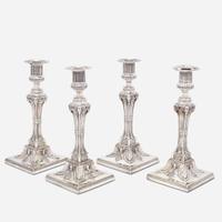 A set of four George III sterling silver weighted candlesticks John Carter II, London, 1774
