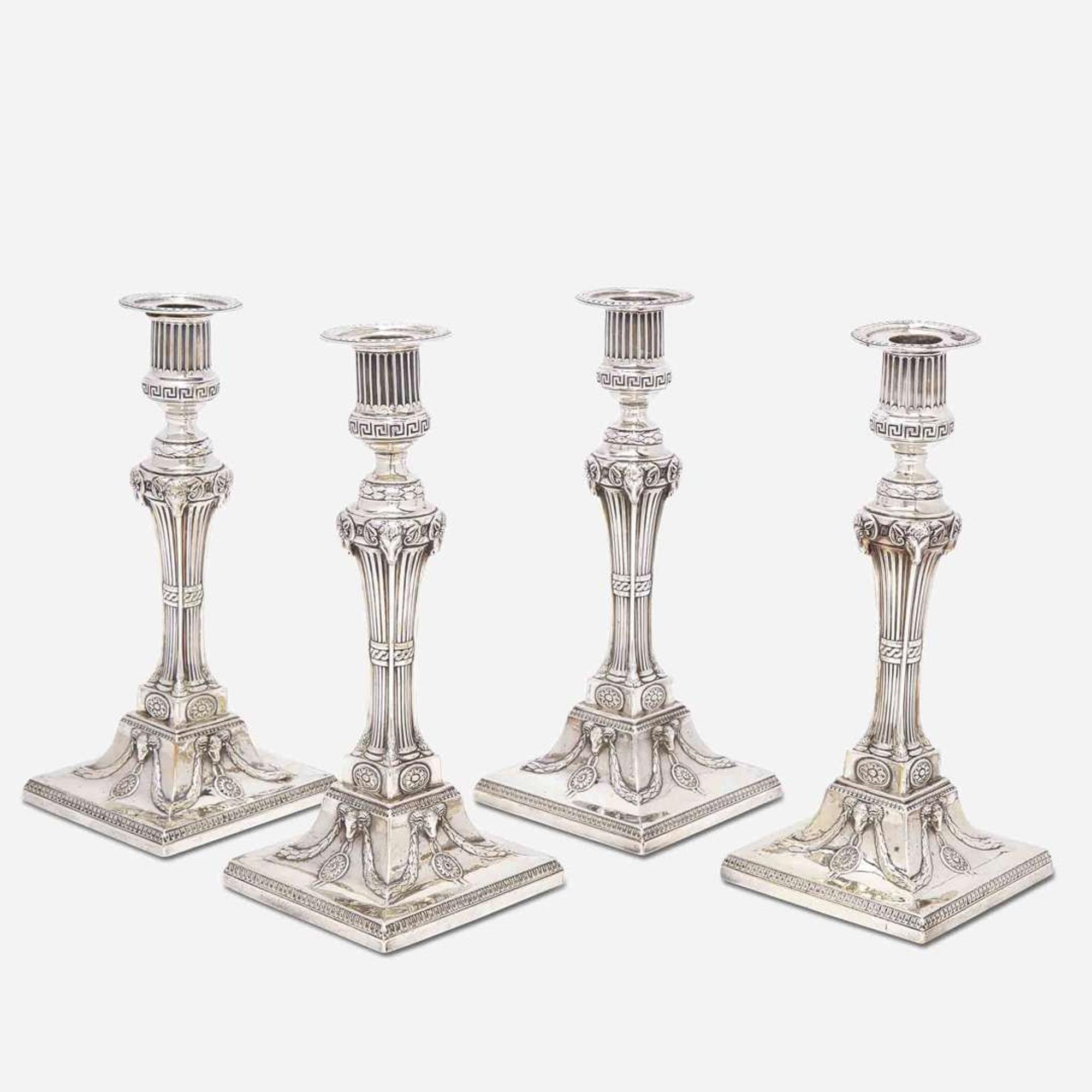 A set of four George III sterling silver weighted candlesticks John Carter II, London, 1774