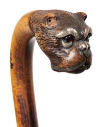 Two English Glass-Inset Carved Wood Dog's Head Canes