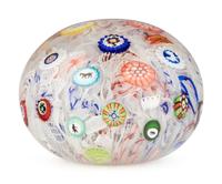 A Baccarat Spaced Concentric Millefiori and Gridel Silhouettes on Upset Muslin Glass Paperweight