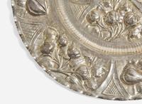 A Portuguese silver repoussé charger, 19th / 20th century