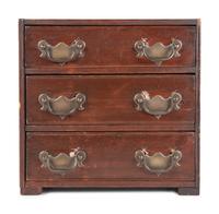 A Stained Pine Miniature Chest of Drawers