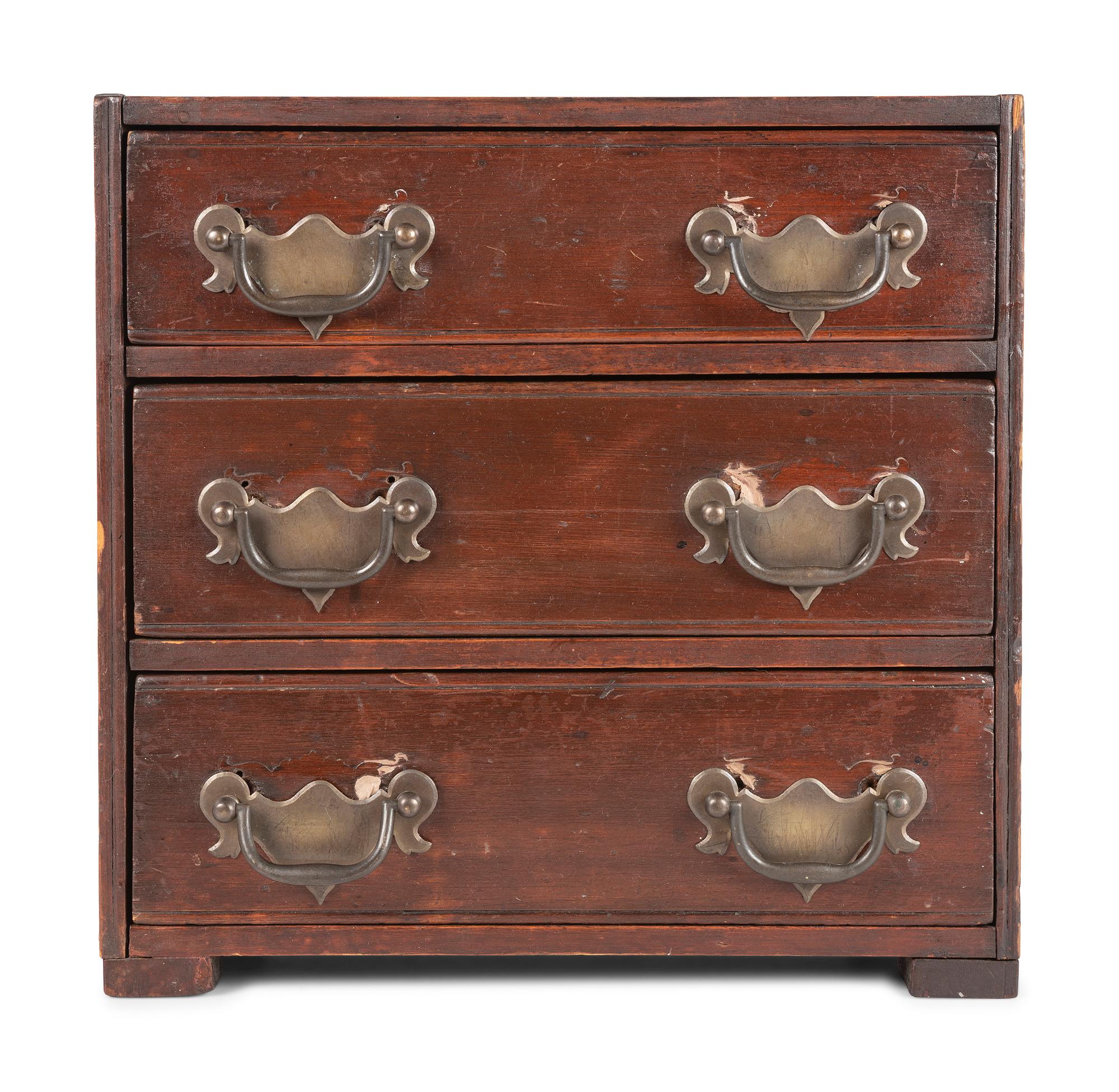 A Stained Pine Miniature Chest of Drawers