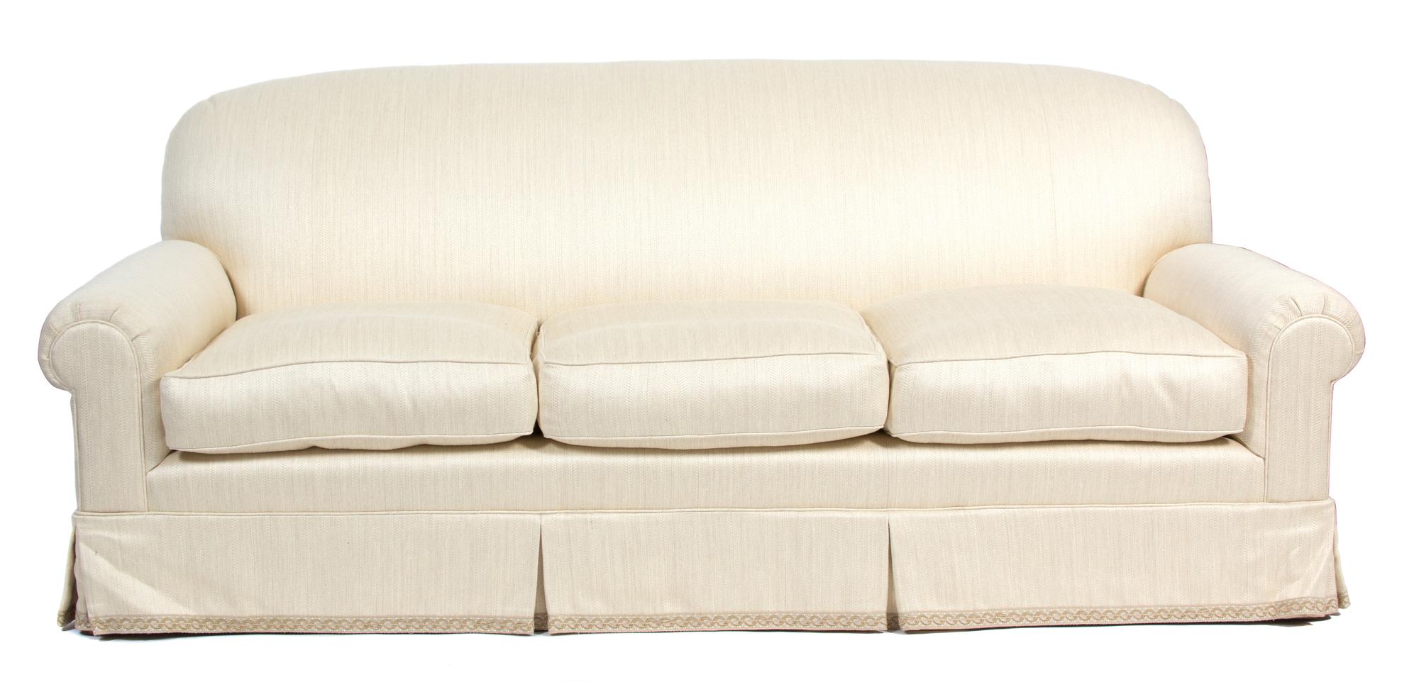 A Contemporary Upholstered Three-Cushion Sofa Height 37 x length 87 inches. — 20TH CENTURY