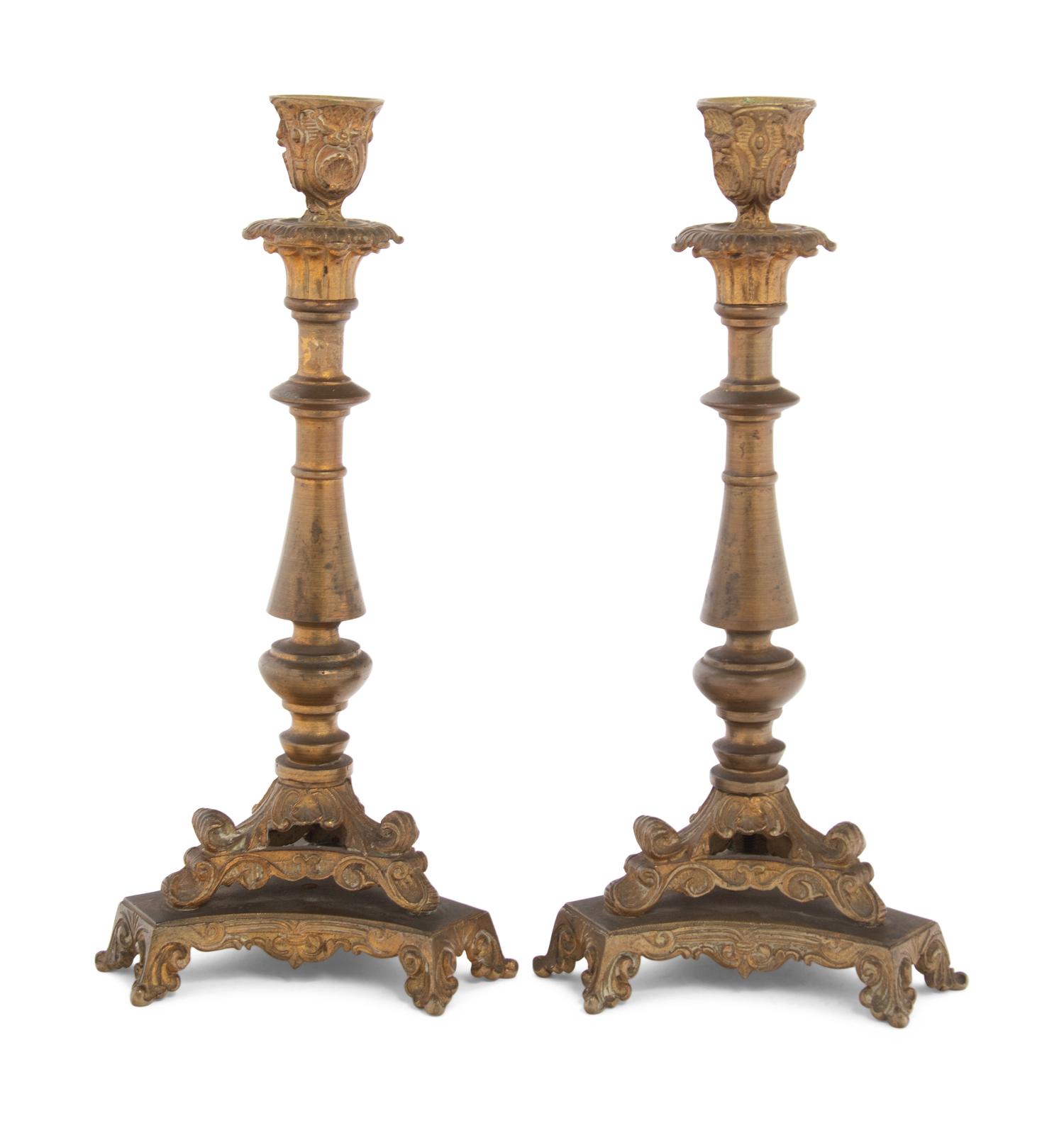 A Pair of Neoclassical Gilt Bronze and Brass Candlesticks
