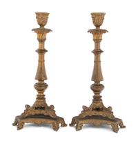 A Pair of Neoclassical Gilt Bronze and Brass Candlesticks