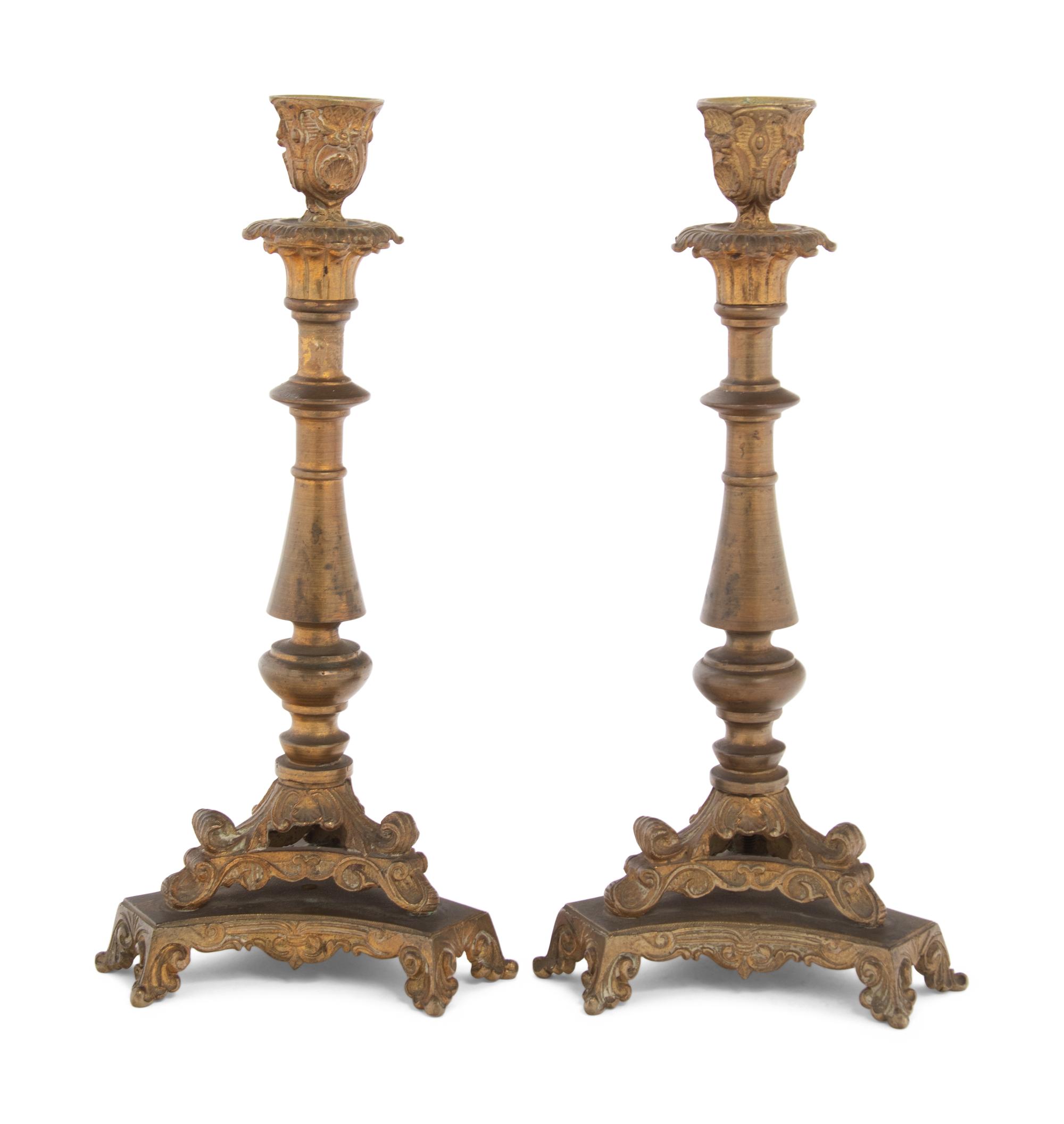 A Pair of Neoclassical Gilt Bronze and Brass Candlesticks
