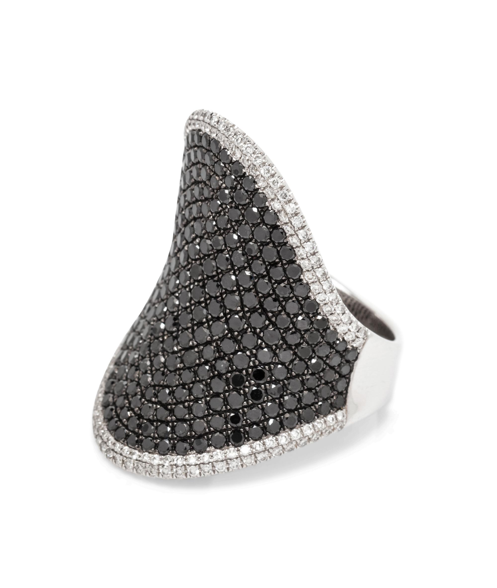 An 18 Karat White Gold, Black Diamond and Diamond Ring,