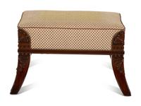 An Egyptian Revival Carved Mahogany Ottoman with Upholstered Seat — 20th Century