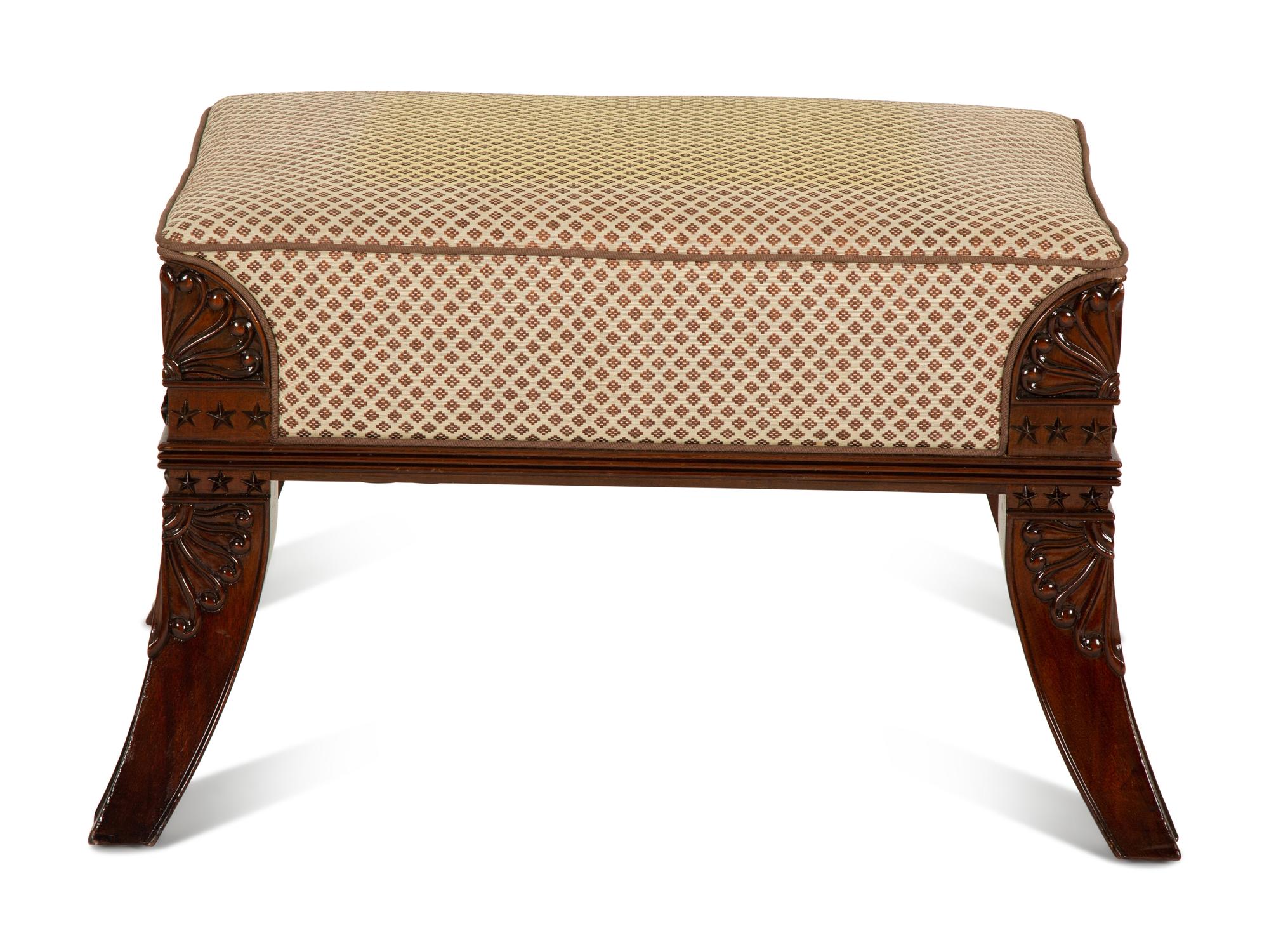 An Egyptian Revival Carved Mahogany Ottoman with Upholstered Seat — 20th Century