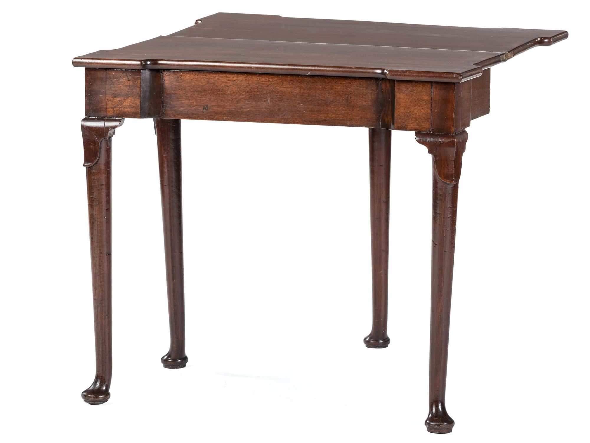 A George III Mahogany Games Table and a Set of Four Queen Anne Style Walnut Dining Chairs