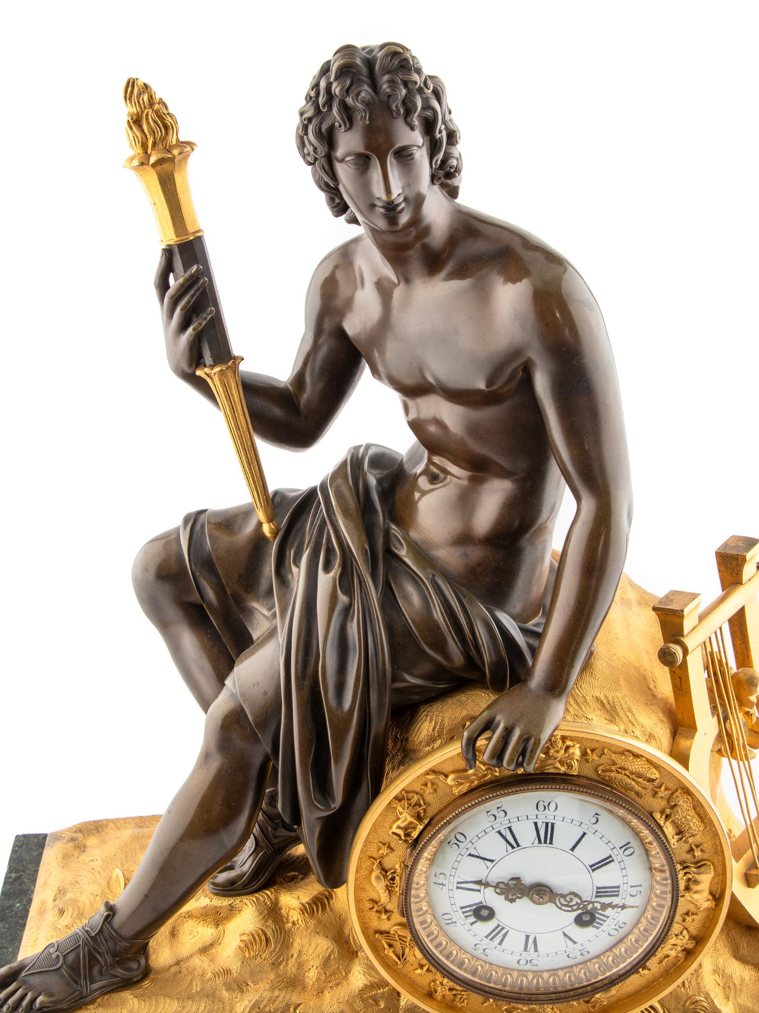 A Louis Philippe Gilt and Patinated Bronze and Marble Mantel Clock