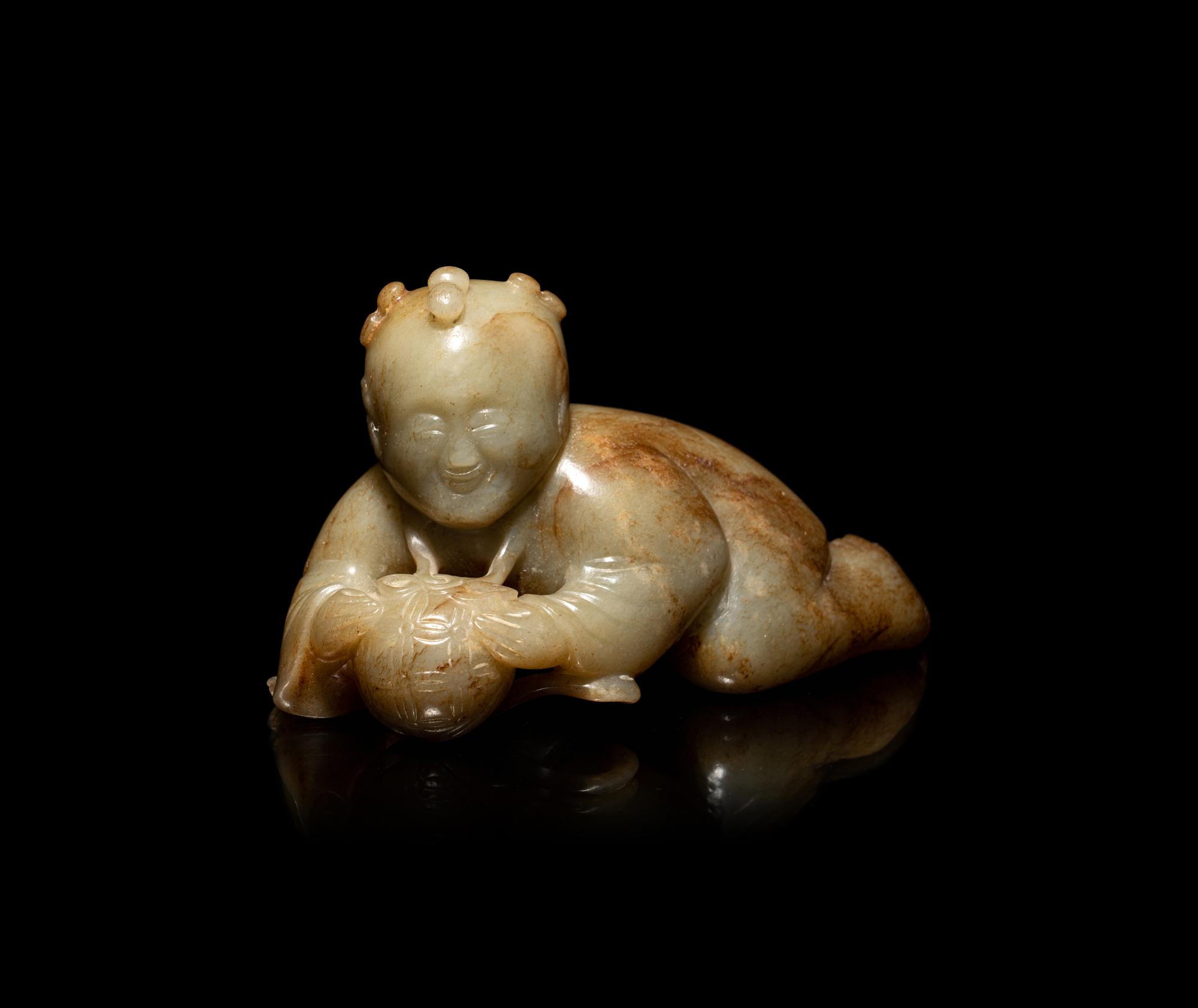 A Chinese Russet and Pale Celadon Jade Figure of a Boy
