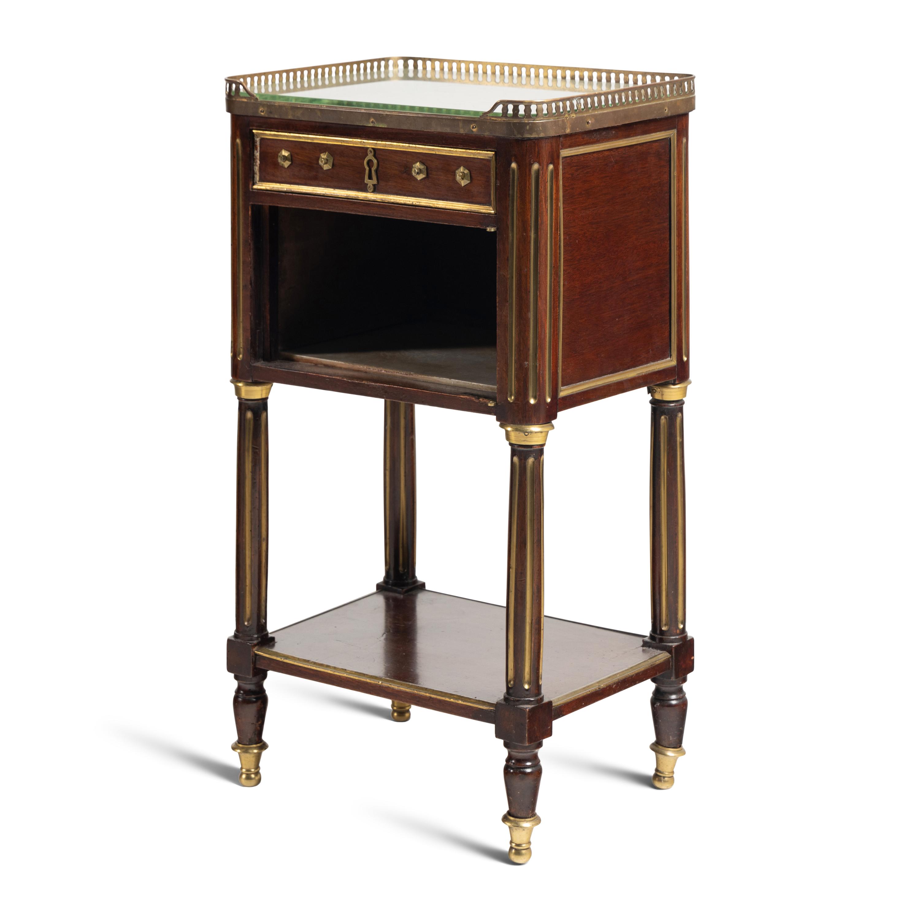 A Directoire Gilt Brass Mounted Mahogany Marble-Top Commode
