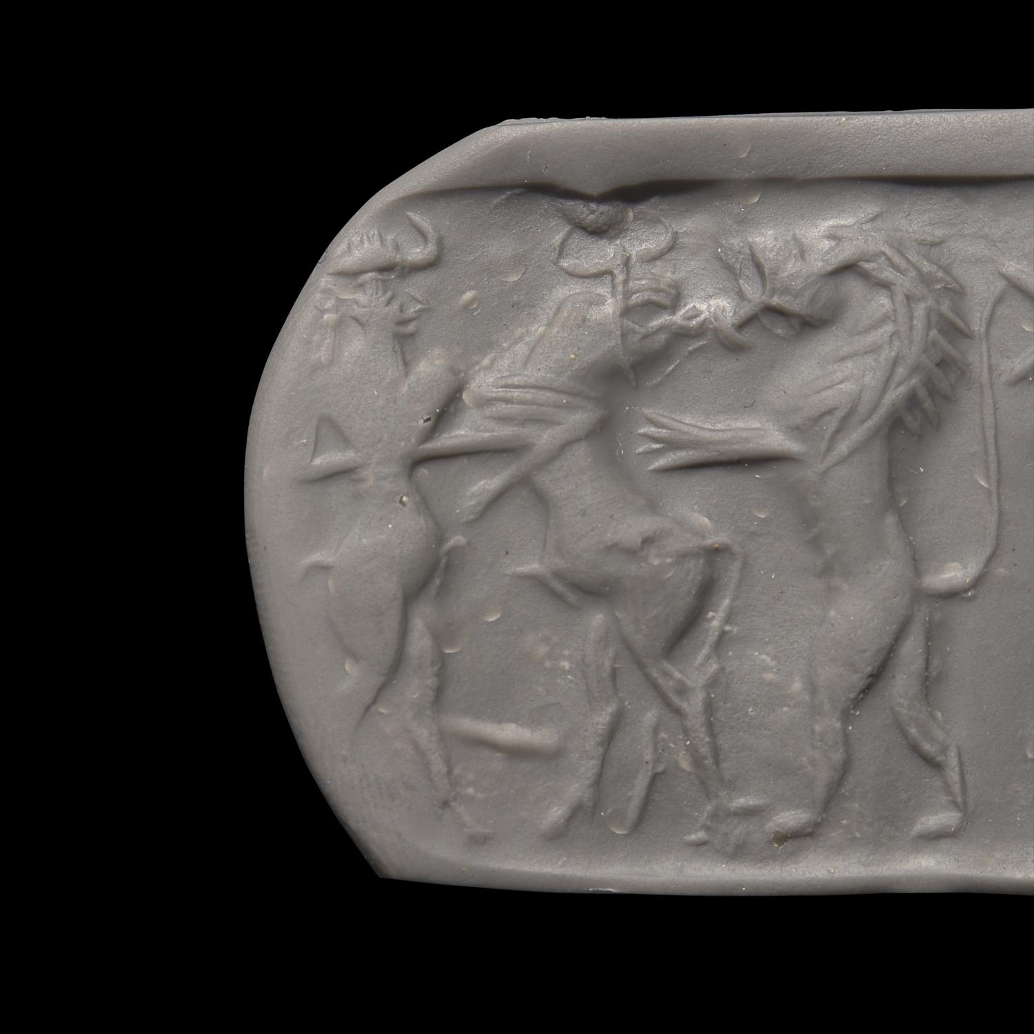 An Akkadian Hematite Cylinder Seal