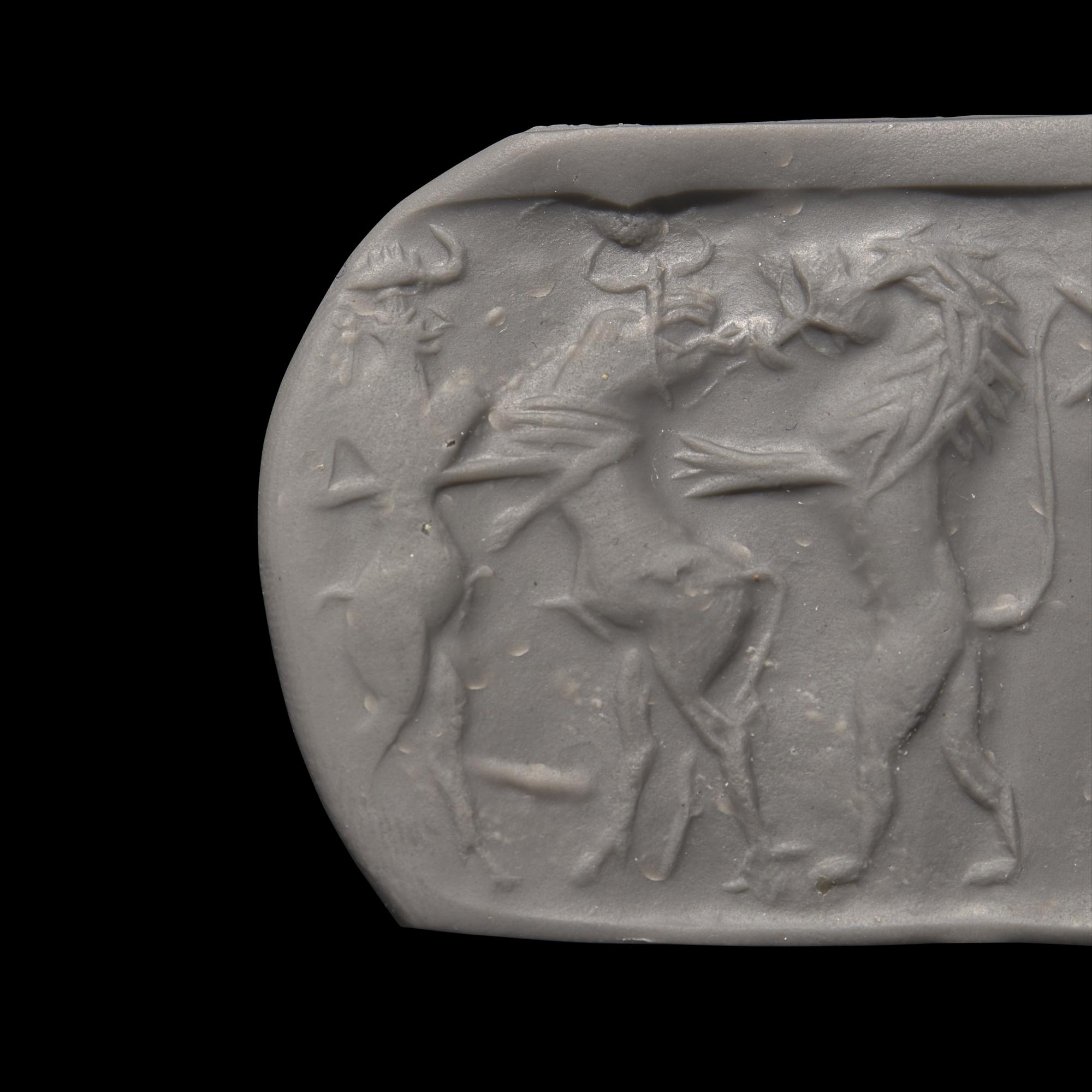 An Akkadian Hematite Cylinder Seal