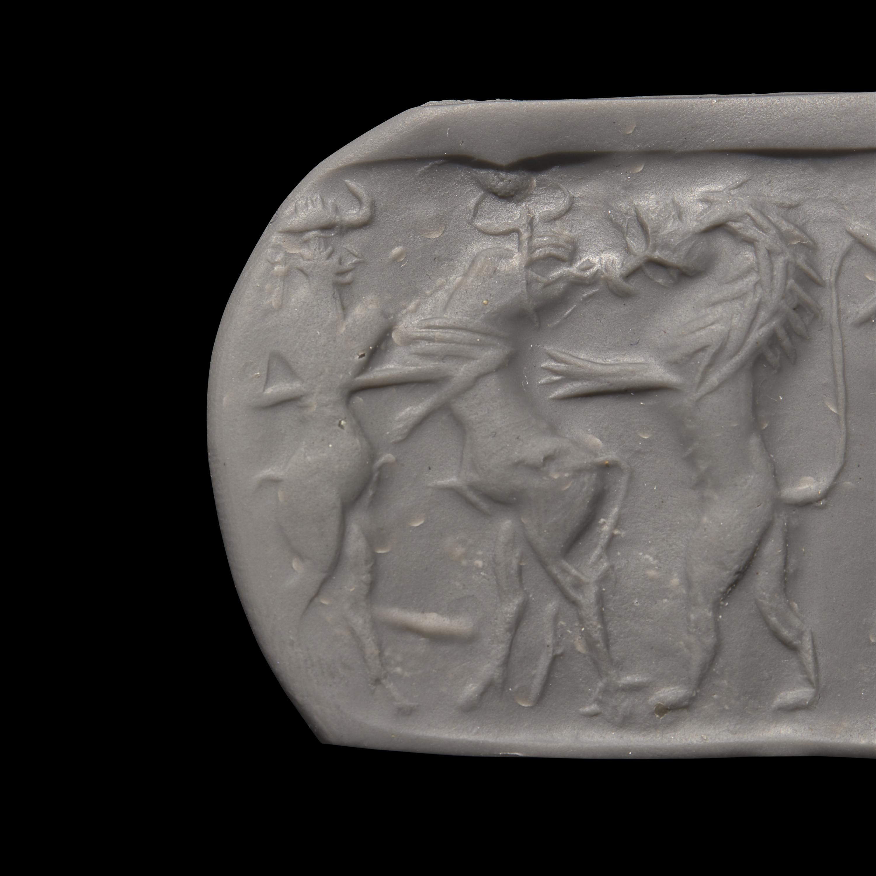 An Akkadian Hematite Cylinder Seal