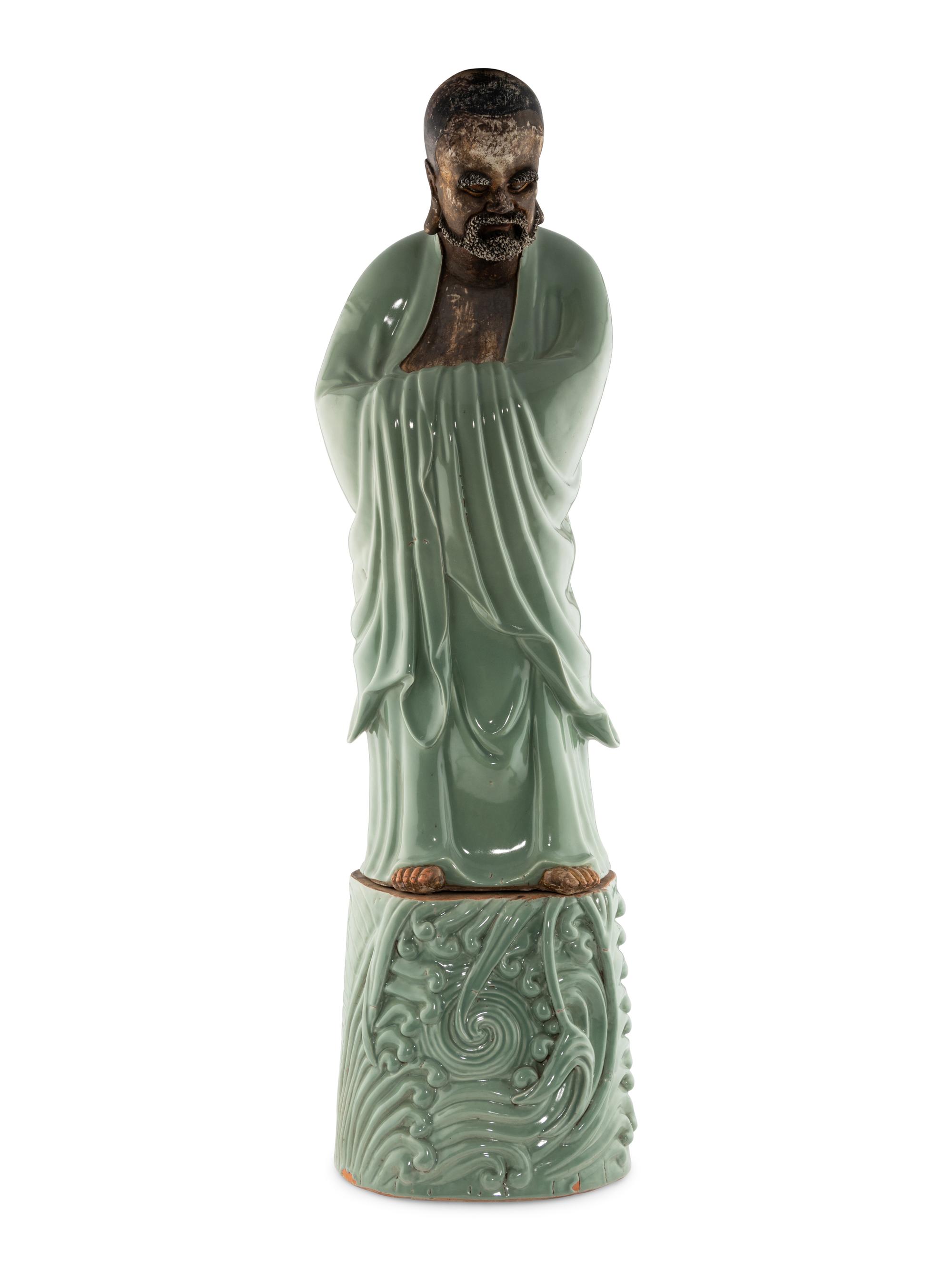 A Large Chinese Celadon Glazed Porcelain Figure of Damo