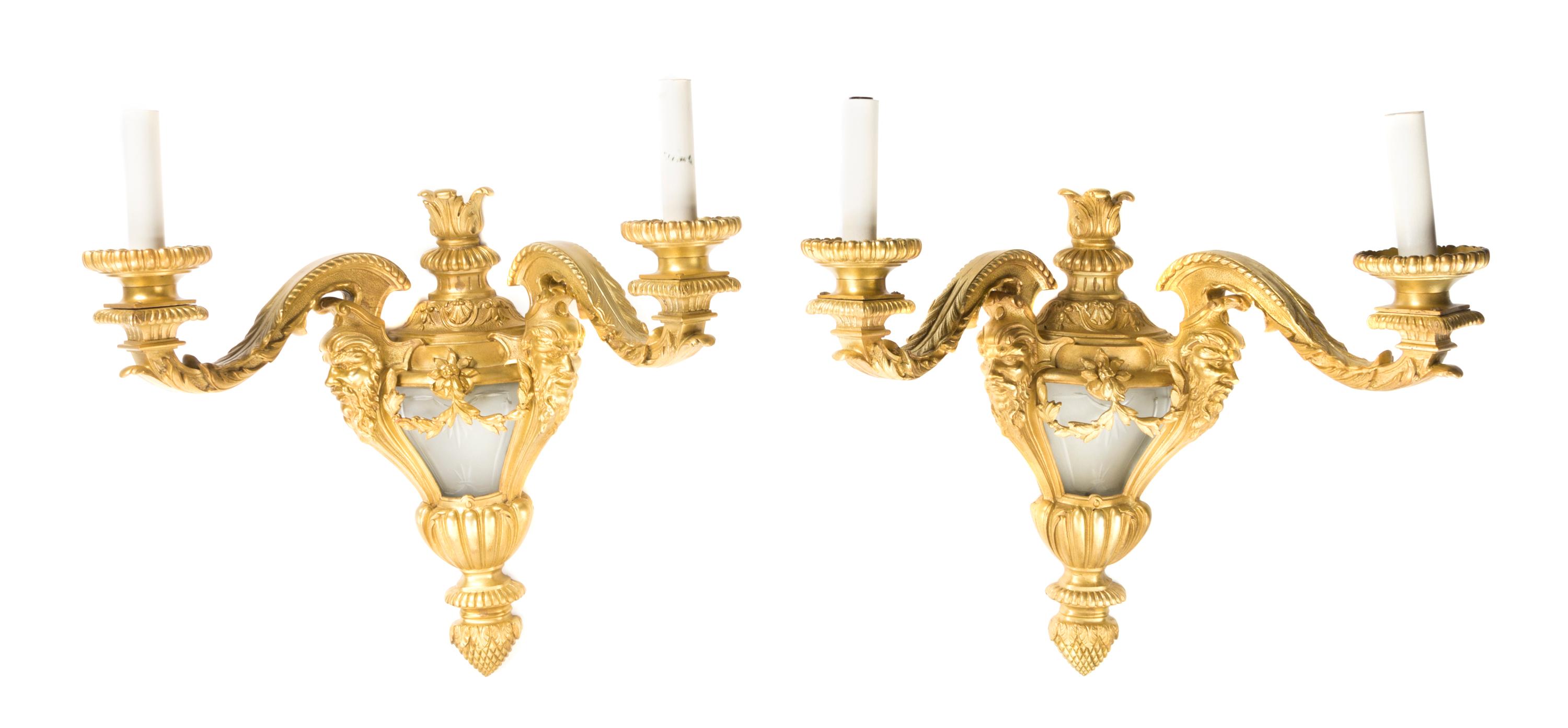 A Pair of Neoclassical Gilt Bronze Two-Light Sconces, Height overall 21 inches.