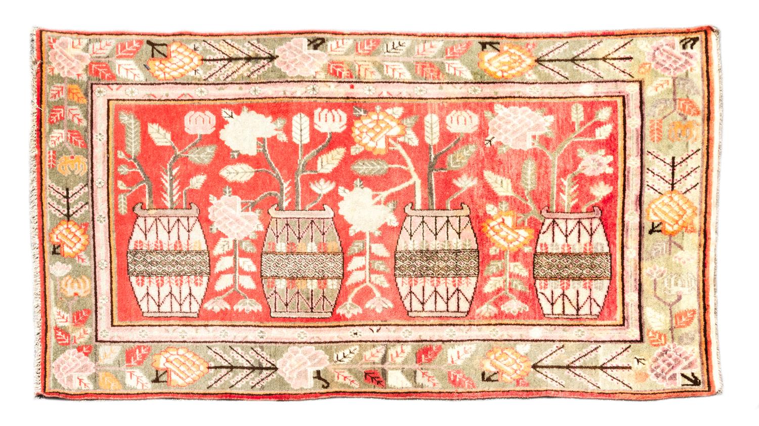 A Persian Wool Rug 8 feet 10 1/2 inches x 5 feet.
