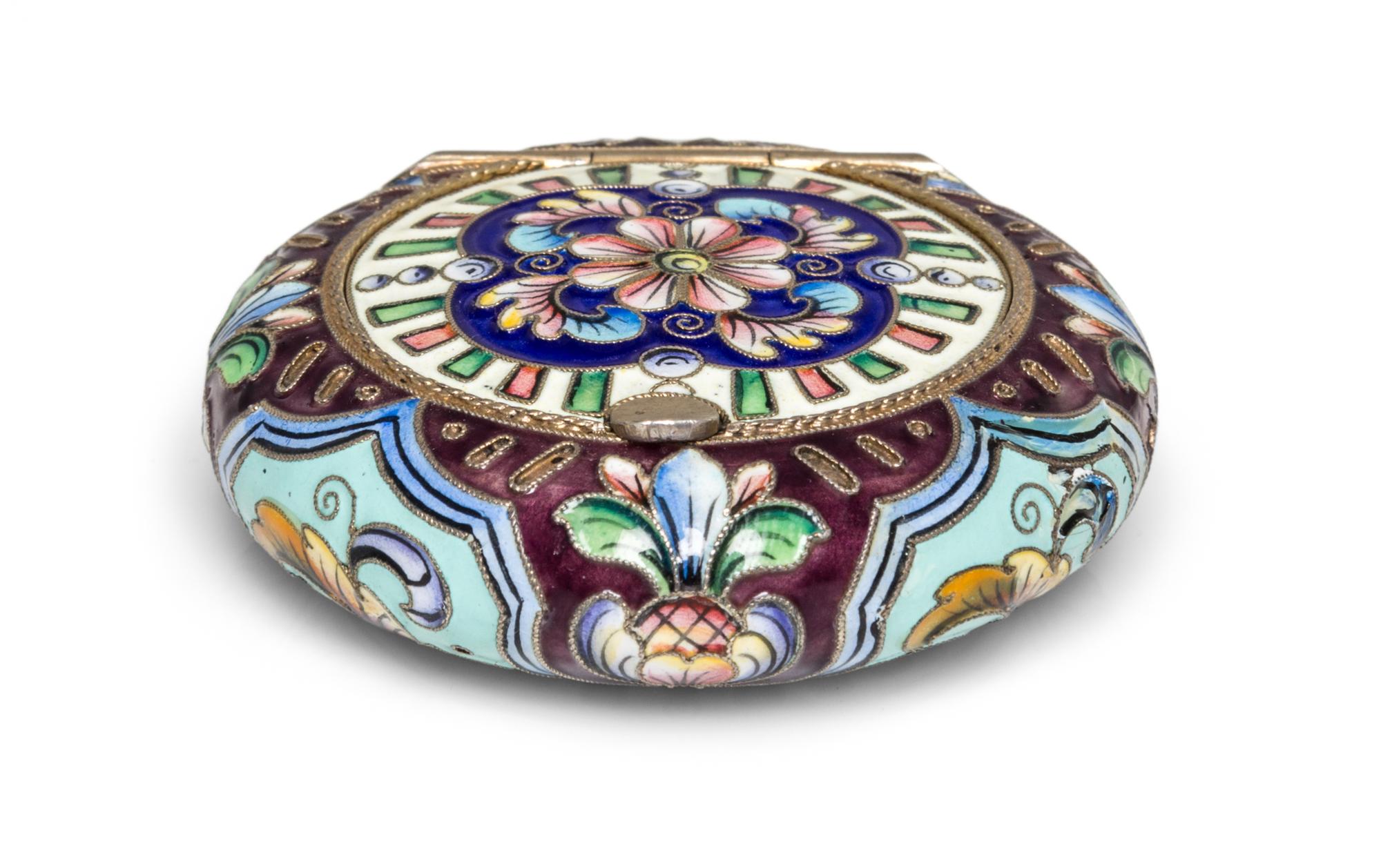 A Russian Enameled Gilt-Silver Pill Box, 6th Artel, Moscow, 1908-1926, of circular form with polychrome floral decoration.