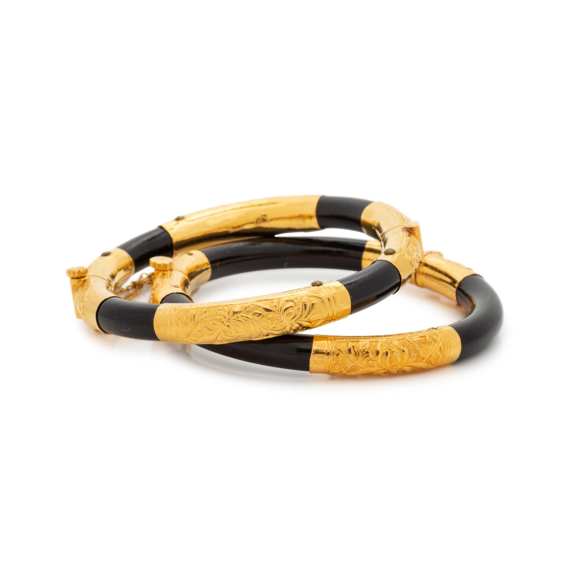 HIGH KARAT GOLD AND WOOD BANGLE SET