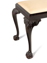 An English Carved Mahogany Stool