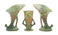 Three Roseville Bushberry Pottery Vases Height of pair 8 1/4 inches, single 9 1/4 inches.