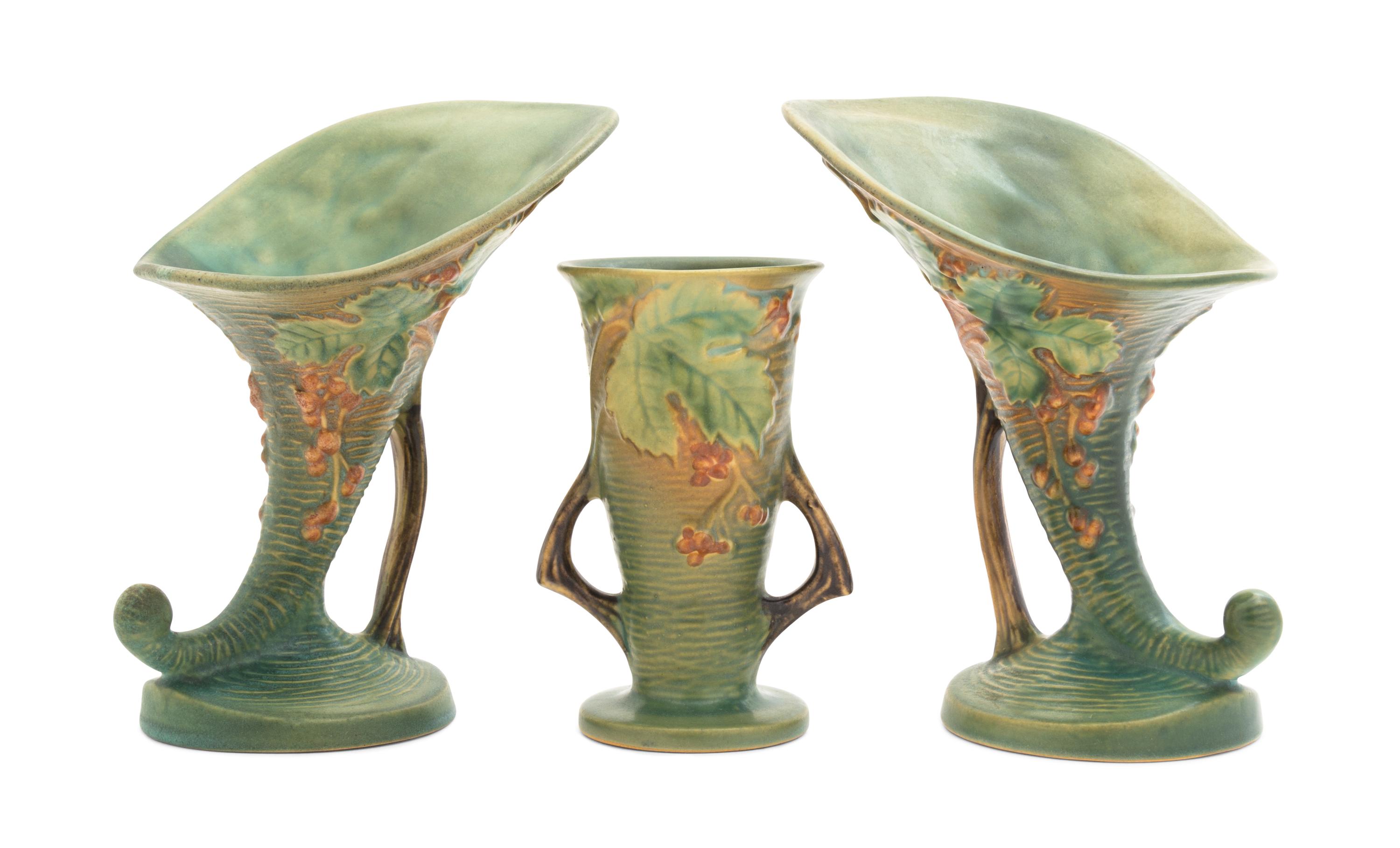 Three Roseville Bushberry Pottery Vases Height of pair 8 1/4 inches, single 9 1/4 inches.