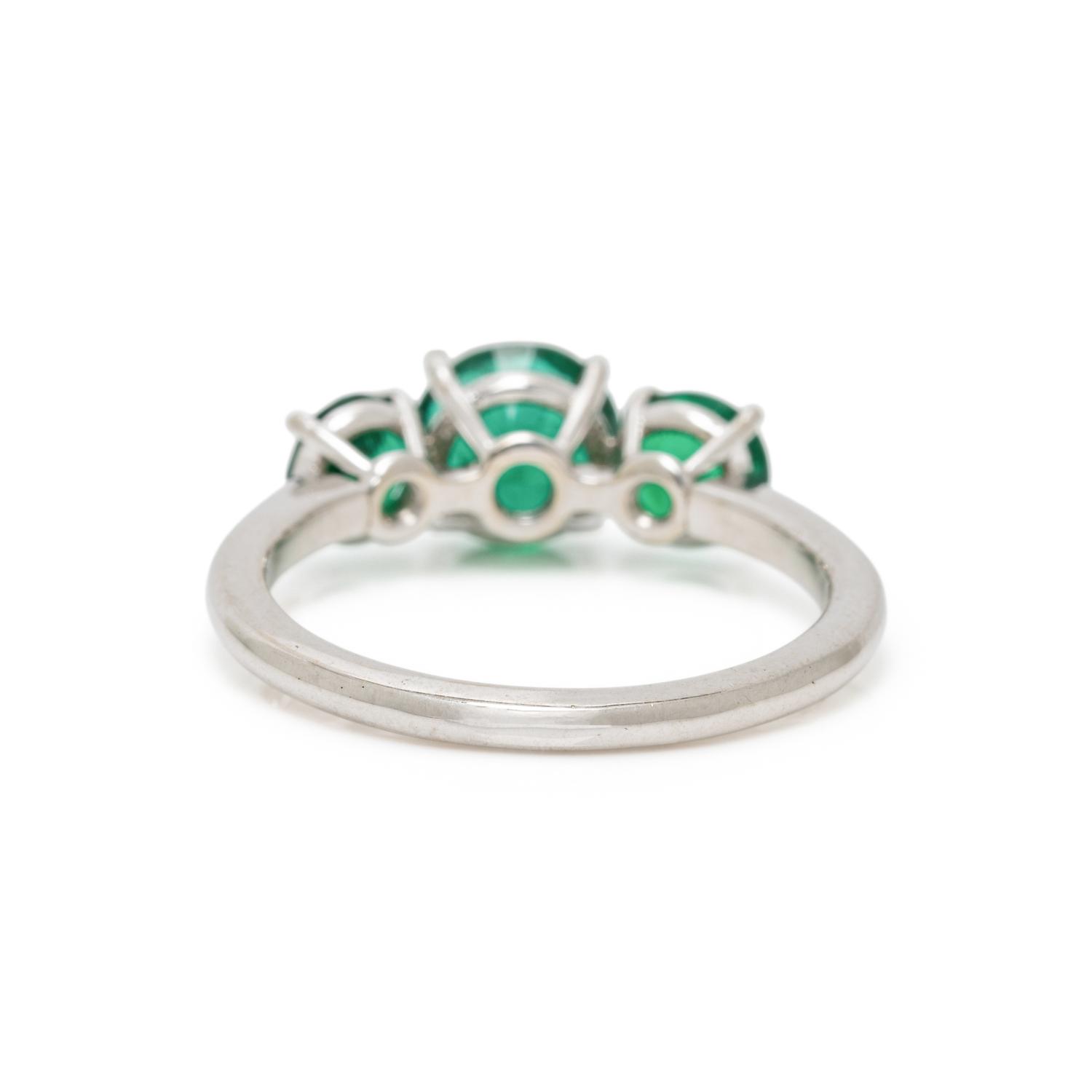 THREE STONE EMERALD AND WHITE GOLD RING