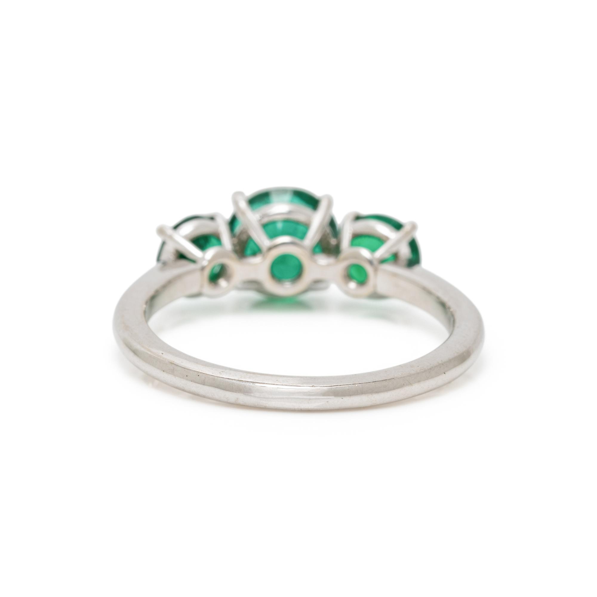 THREE STONE EMERALD AND WHITE GOLD RING