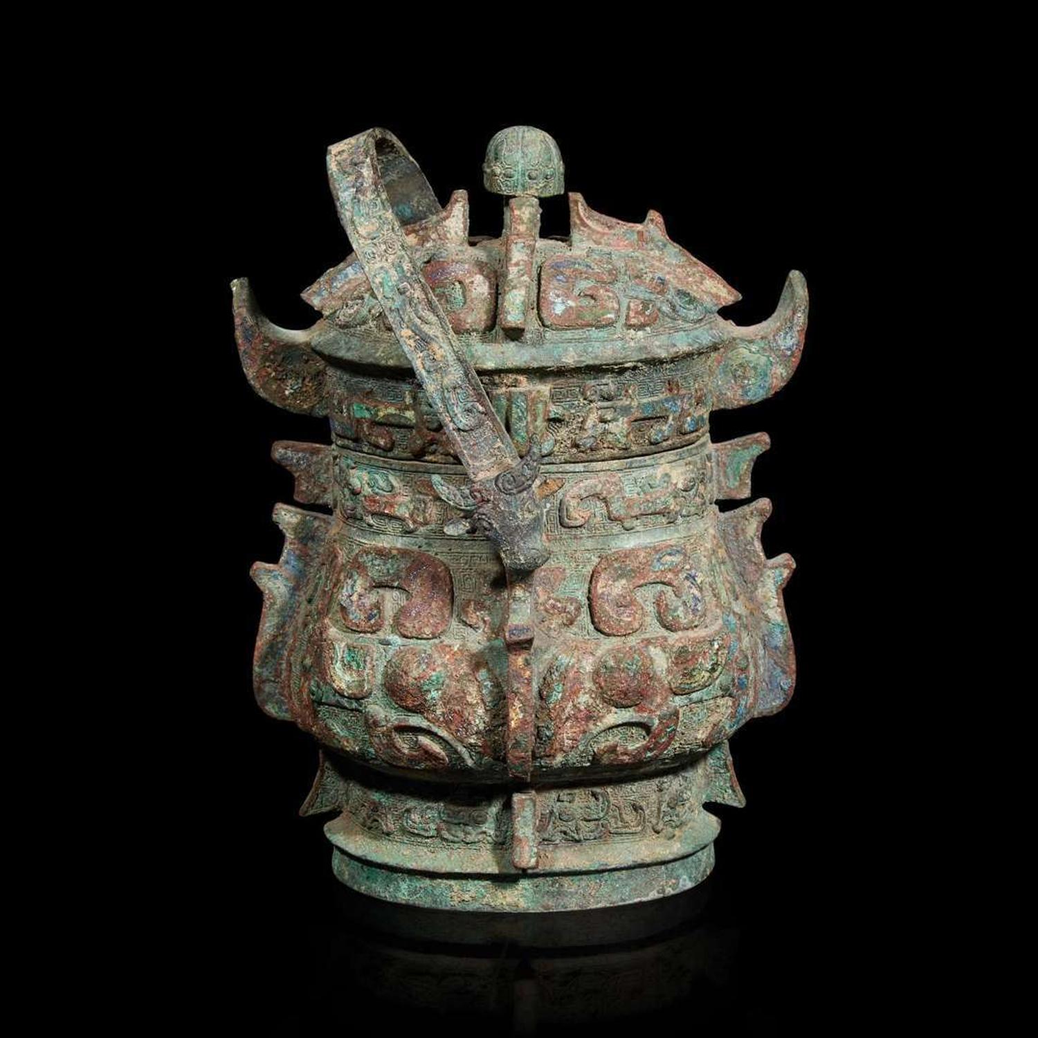 A Chinese archaistic bronze covered ritual wine vessel, You 青銅提梁卣