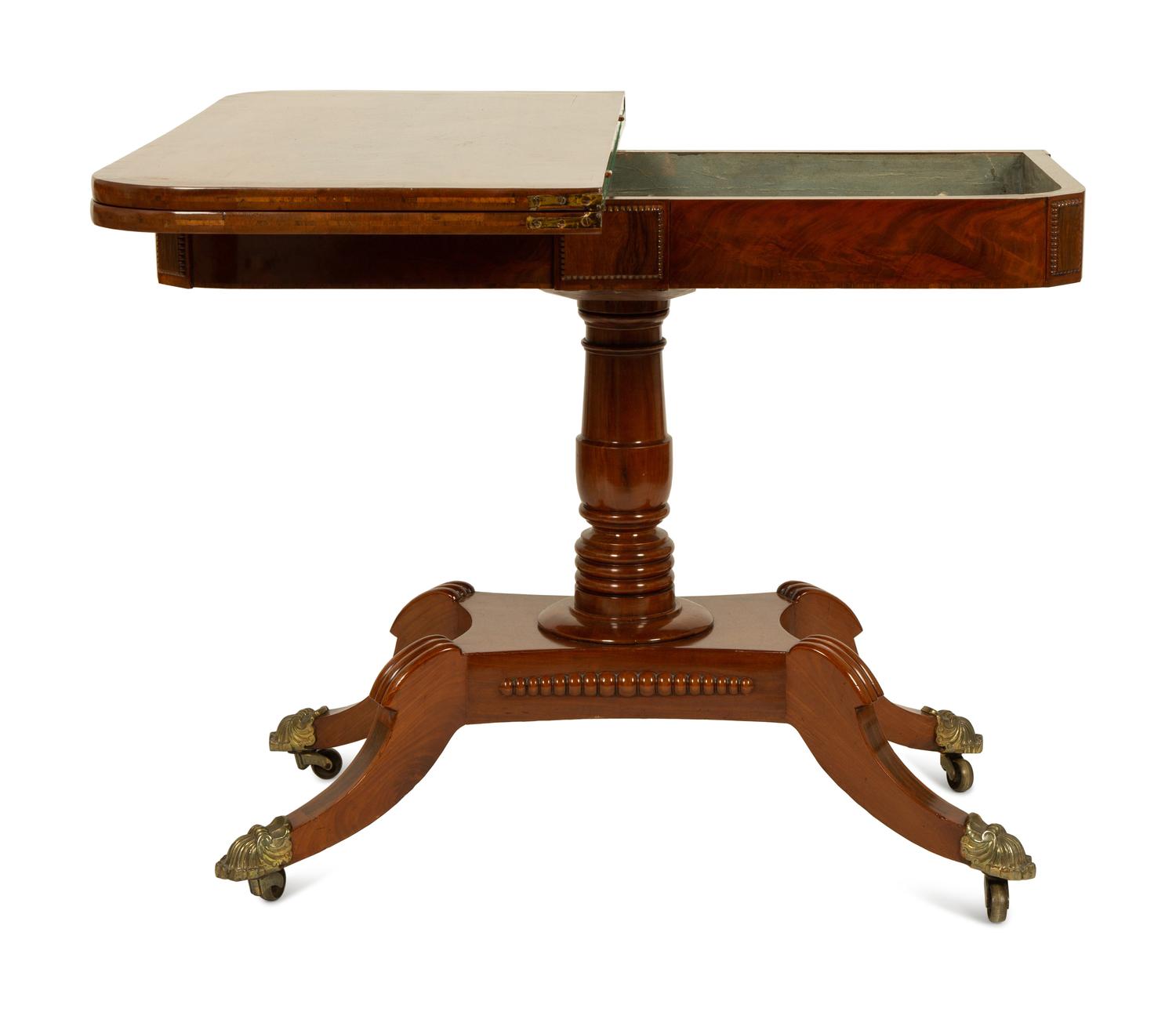 A Pair of Regency Flame Mahogany Flip-Top Games Tables — 19TH CENTURY