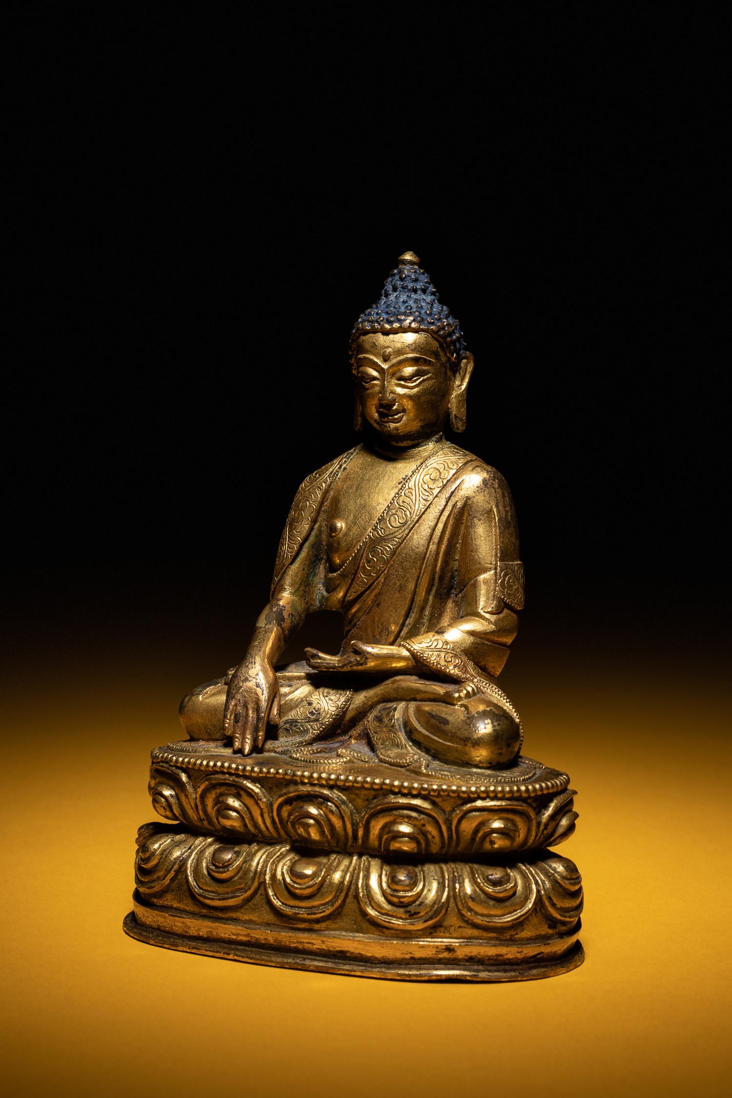 A Small Sino-Tibetan Gilt Bronze Figure of Seated Buddha Shakyamuni