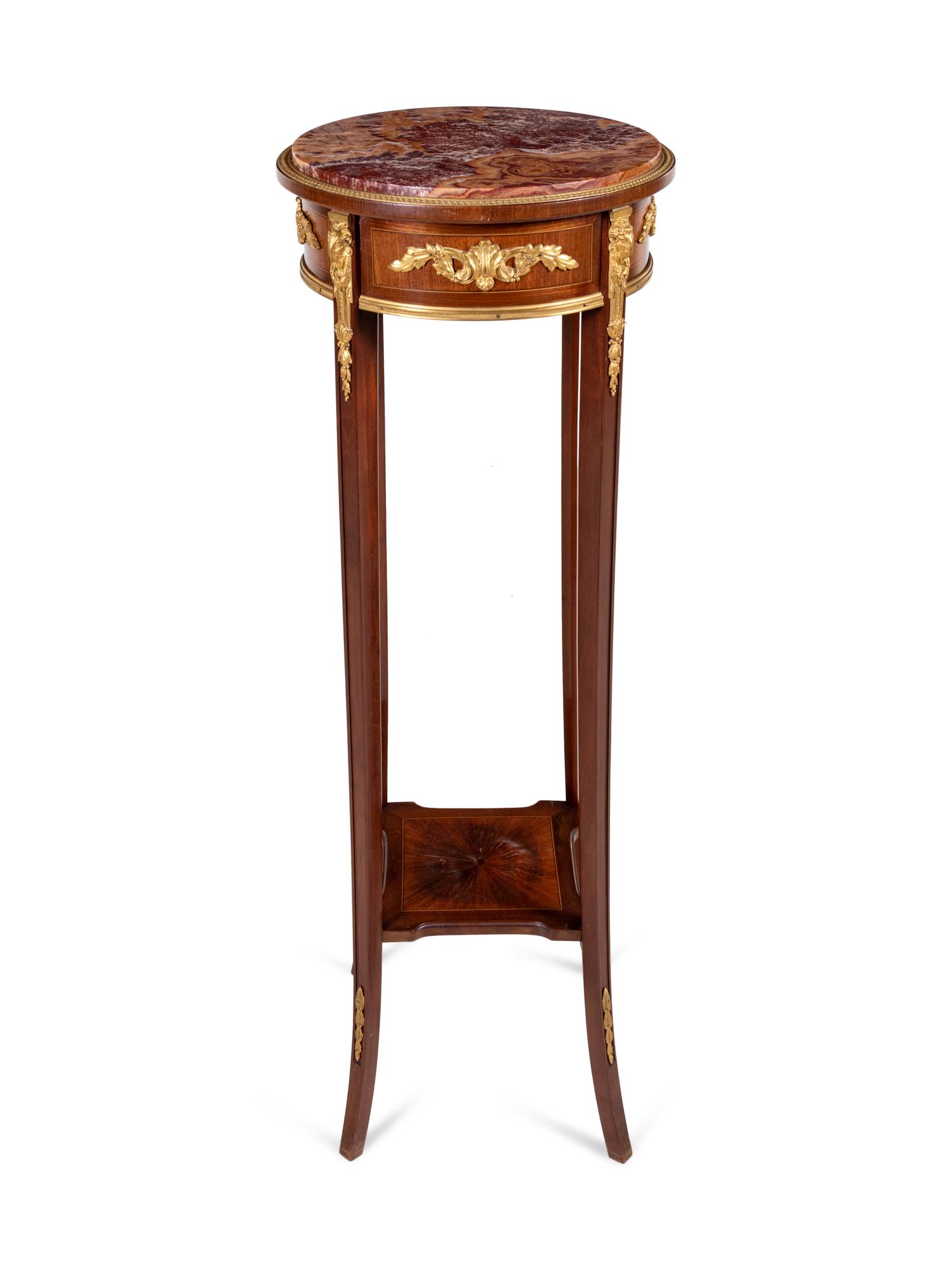 A Louis XVI Style Gilt Bronze Mounted Mahogany Marble-Top Pedestal Table