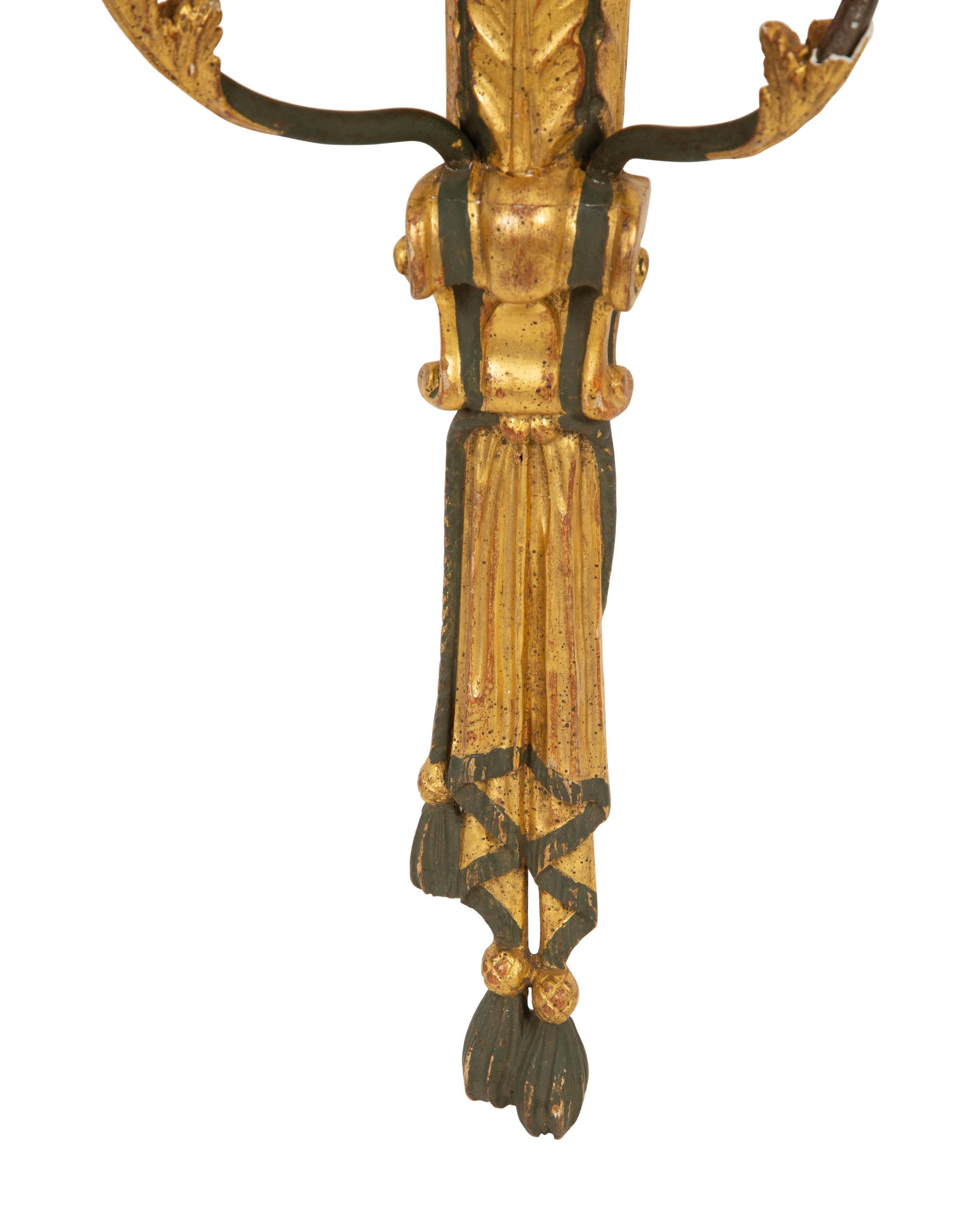 A Pair of Painted and Parcel Gilt Carved Wood Sconces