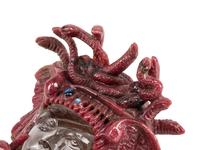 A Carved Rhodonite and Rock Crystal Medusa Mask