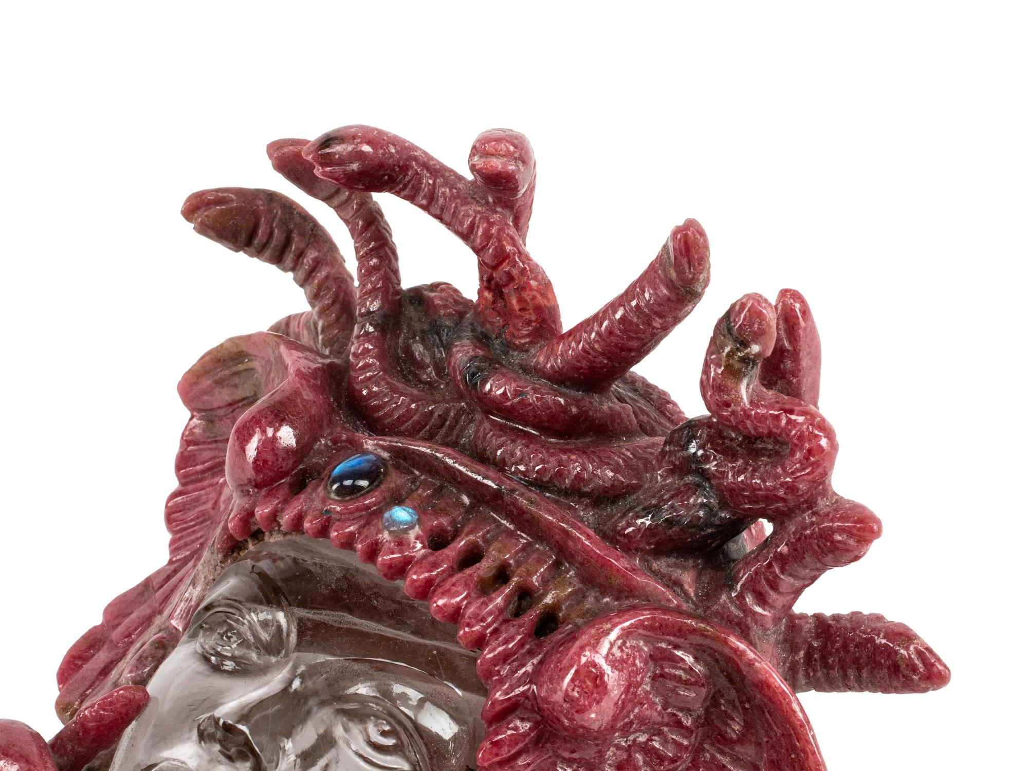 A Carved Rhodonite and Rock Crystal Medusa Mask