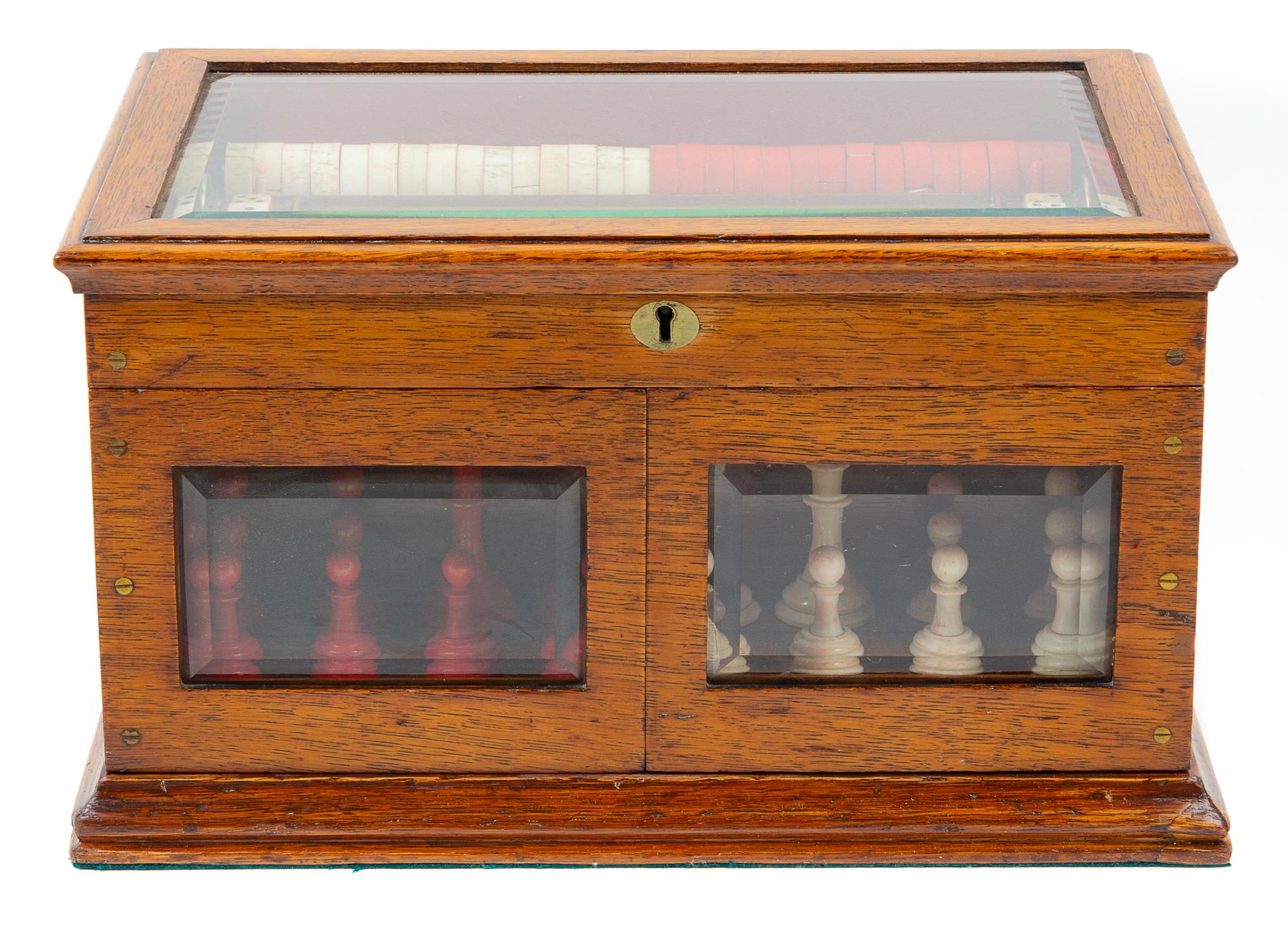 A Victorian Oak Games Compendium Height 7 3/4 x width 13 3/4 x depth 9 5/8 inches. — 19TH CENTURY