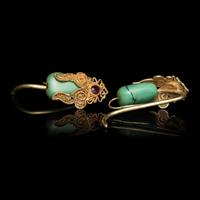 A Pair of Chinese Turquoise and Gold Filigree 'Eggplant' Earrings, Erhuan, Yuan Dynasty 元 金累絲鑲綠松石天茄式耳環一對