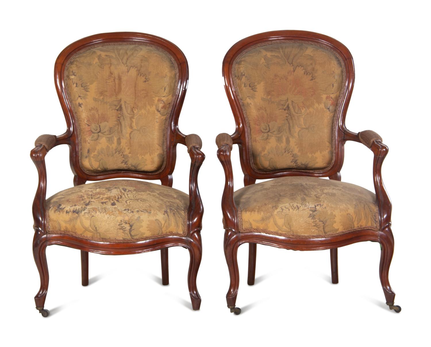 A Pair of Victorian Rococo Revival Walnut Armchairs