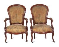A Pair of Victorian Rococo Revival Walnut Armchairs