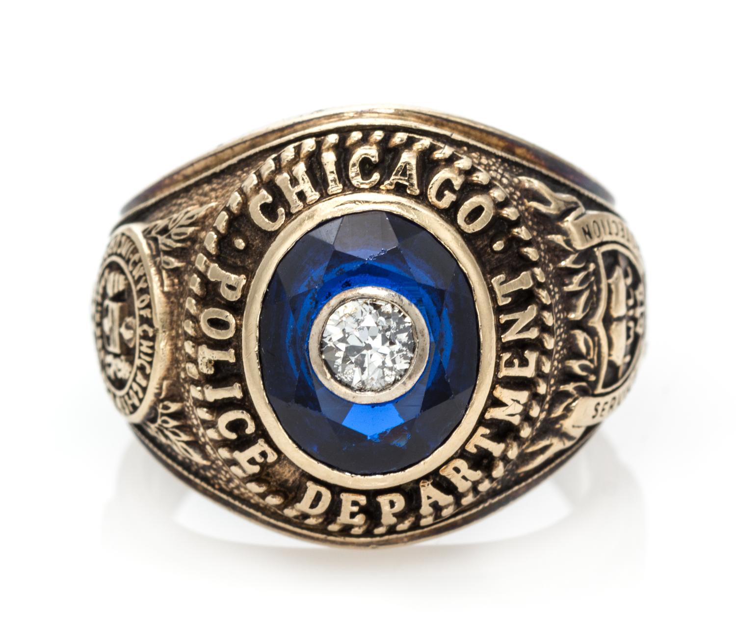 A 10 Karat Yellow Gold, Synthetic Sapphire and Diamond Chicago Police Department Ring, 9.20 dwts.
