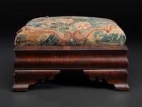 An American Empire Mahogany Veneered and Needlepoint Upholstered Footstool