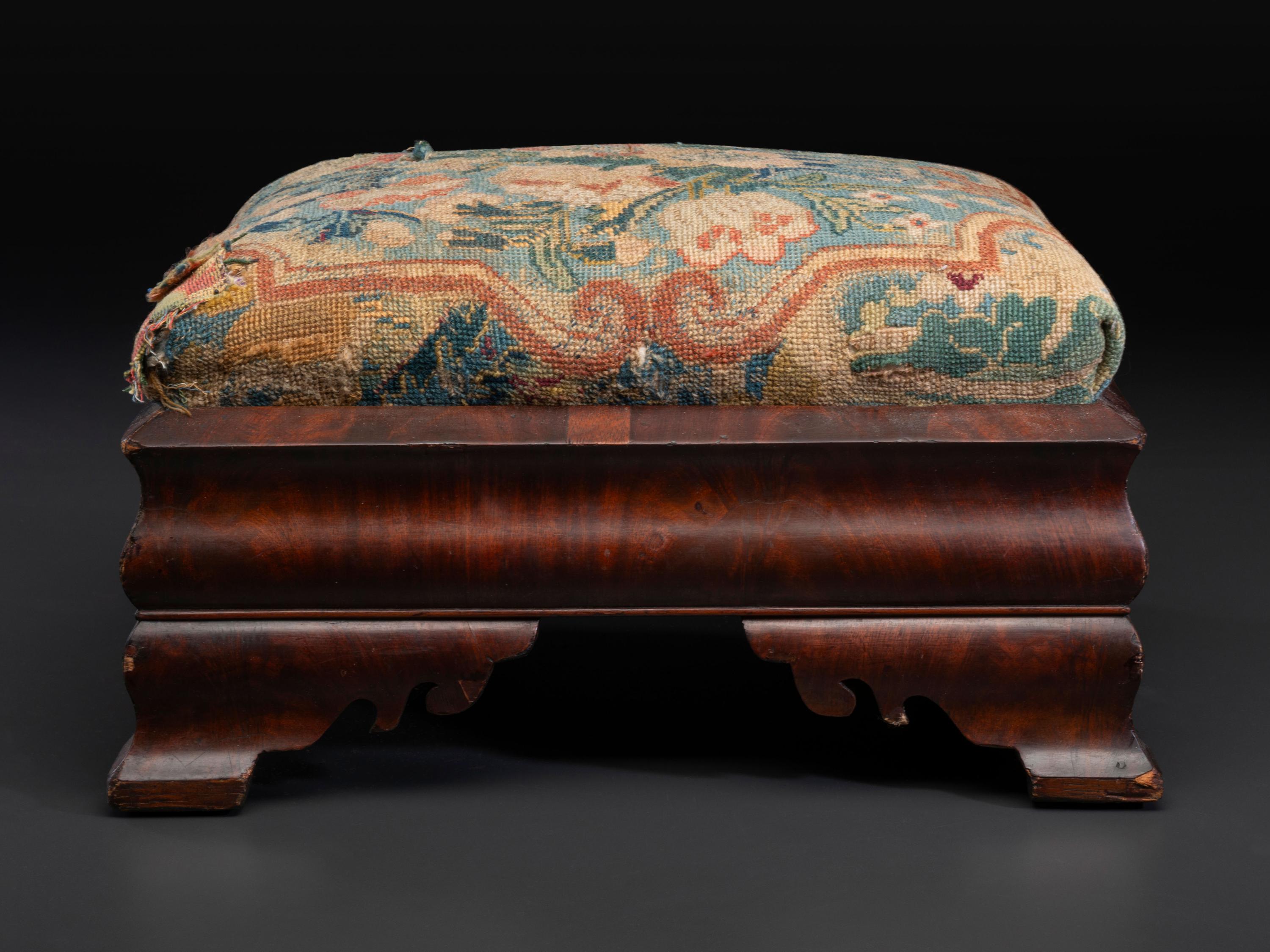 An American Empire Mahogany Veneered and Needlepoint Upholstered Footstool