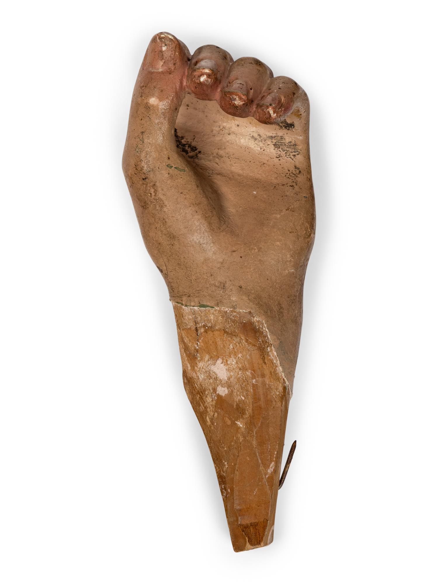 A Carved and Painted Wood Fragment of a Hand