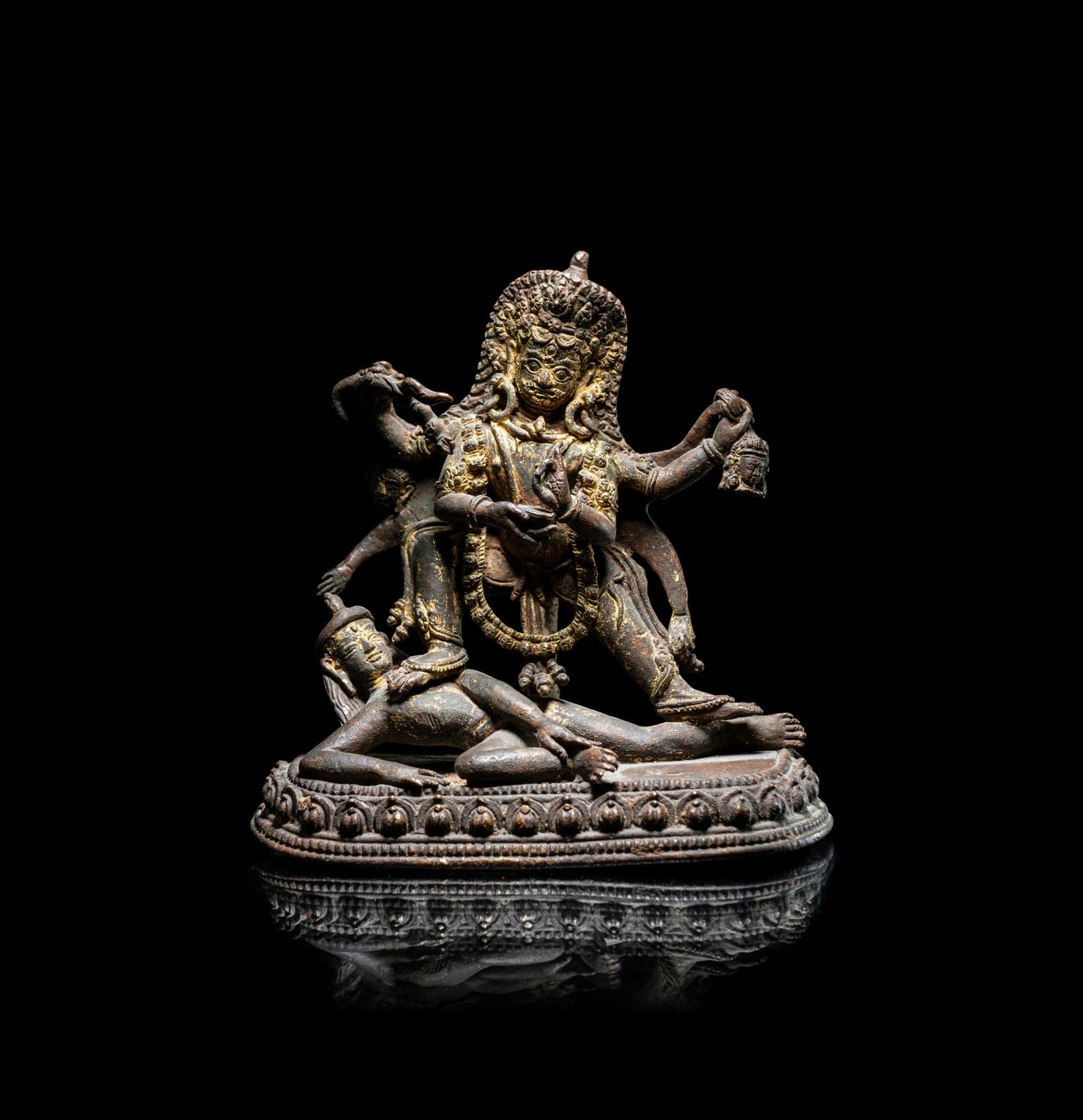 A Nepalese Parcel Gilt Bronze Figure of Kali