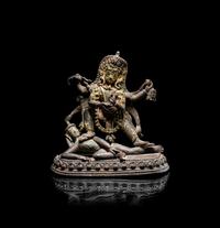 A Nepalese Parcel Gilt Bronze Figure of Kali