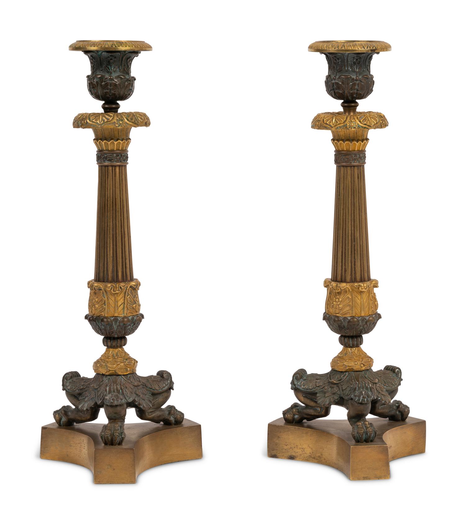A Pair of Neoclassical Style Gilt and Patinated Bronze Candlesticks